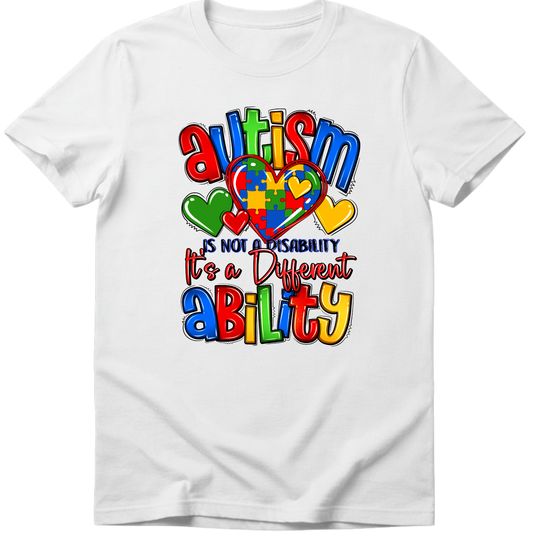 White t-shirt with colorful autism awareness design on a white background