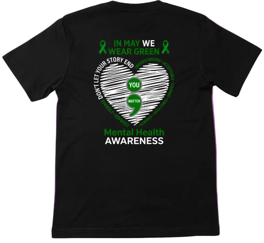 Black t-shirt with green and white mental health awareness design on a white background